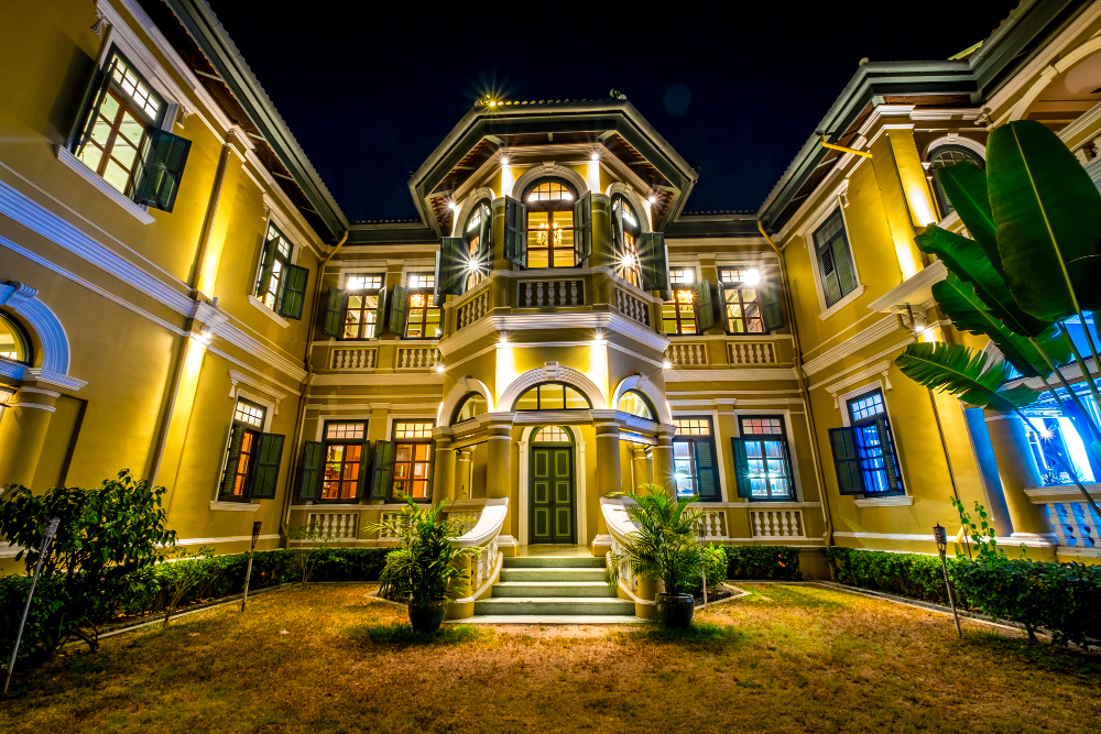 "Hotel Mayfair Lahore exterior view at night."