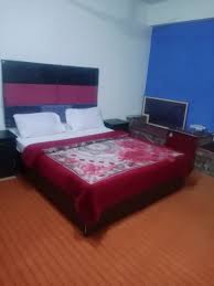 Front view of New Shaheen Hotel Mirpur showing the hotel entrance and building facade.